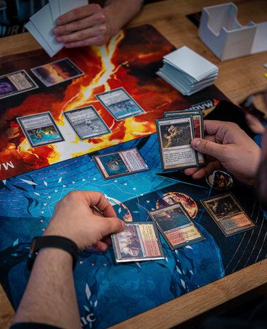 People playing Magic: The Gathering at a table